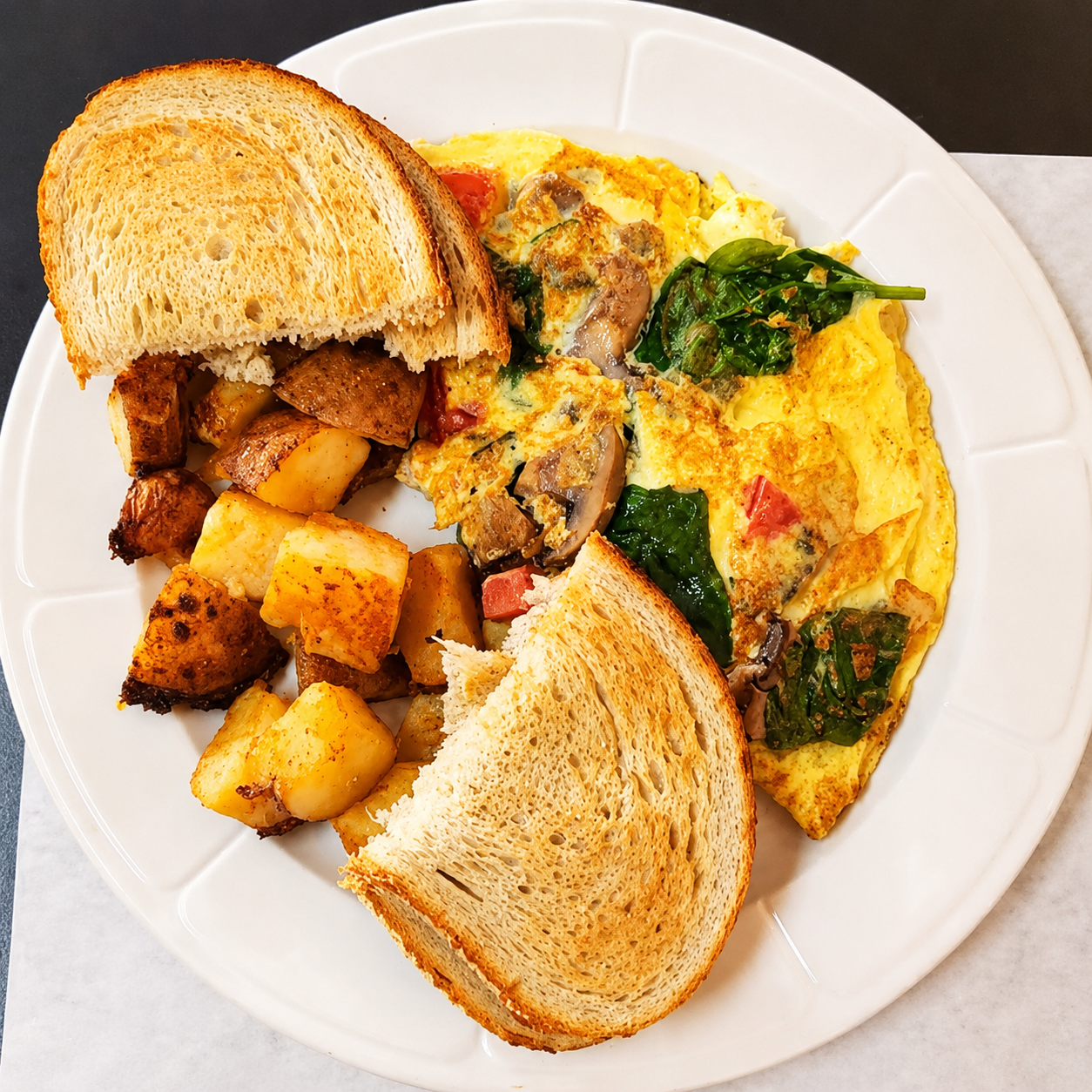 Fresh bread, butter, and eggs breakfast plate